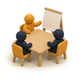 A meeting around a boardroom table.